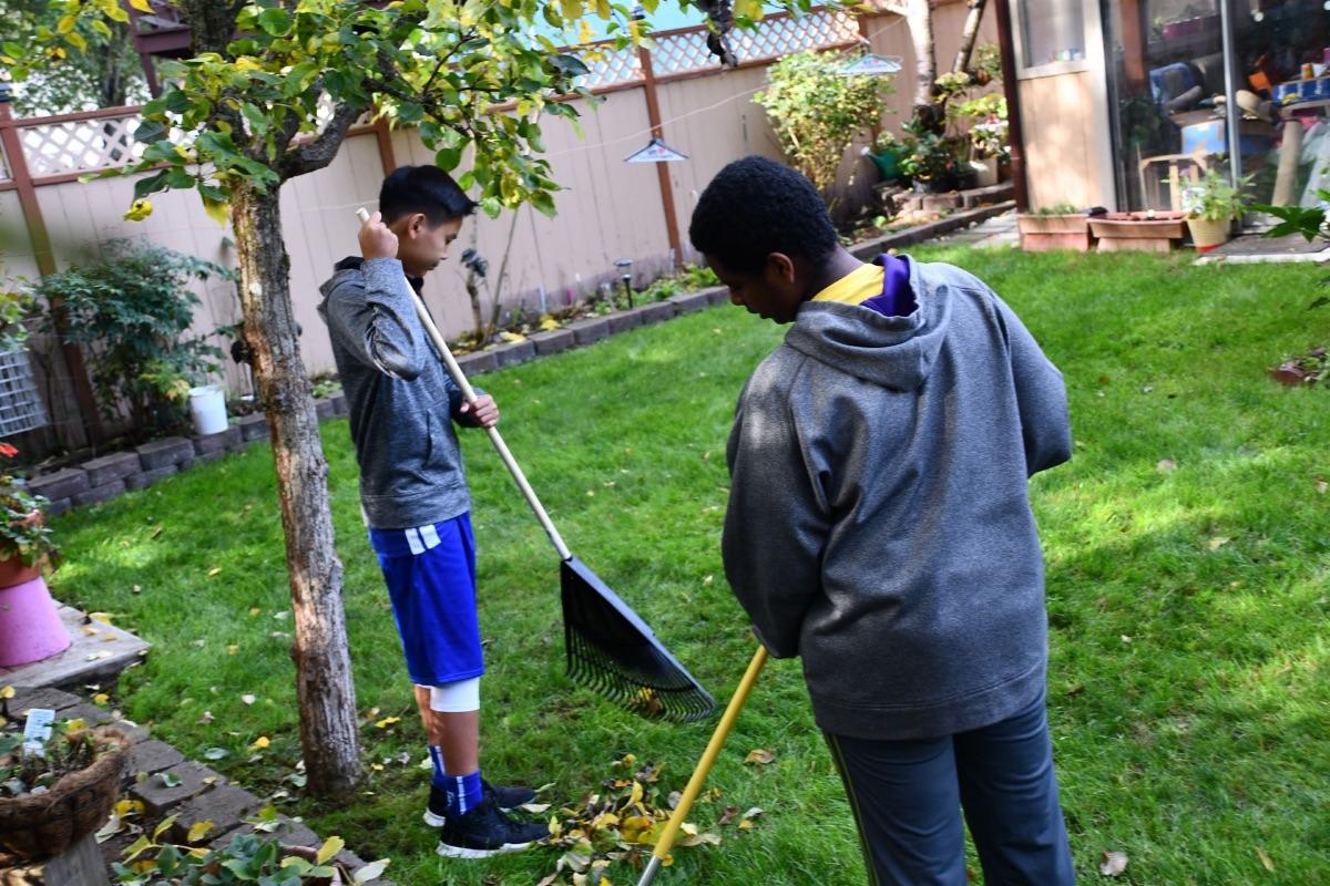 8th Graders raking leaves for the neighbors