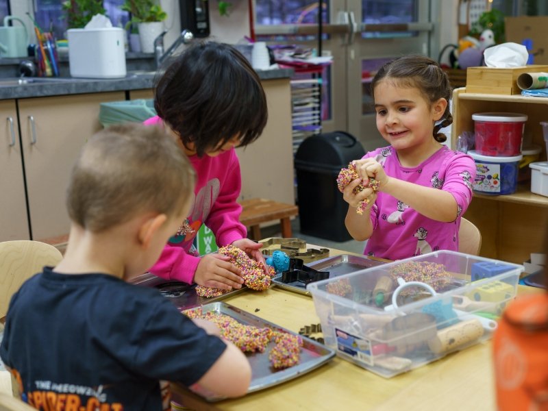 group of students enjoying playing with a texture craft