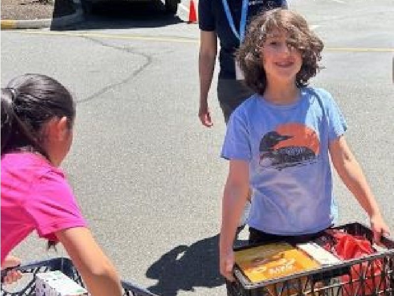 students filling baskets with food donations