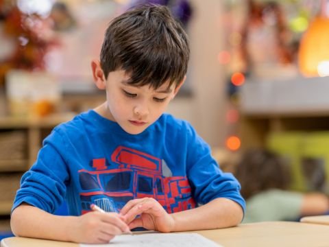 student in class writing